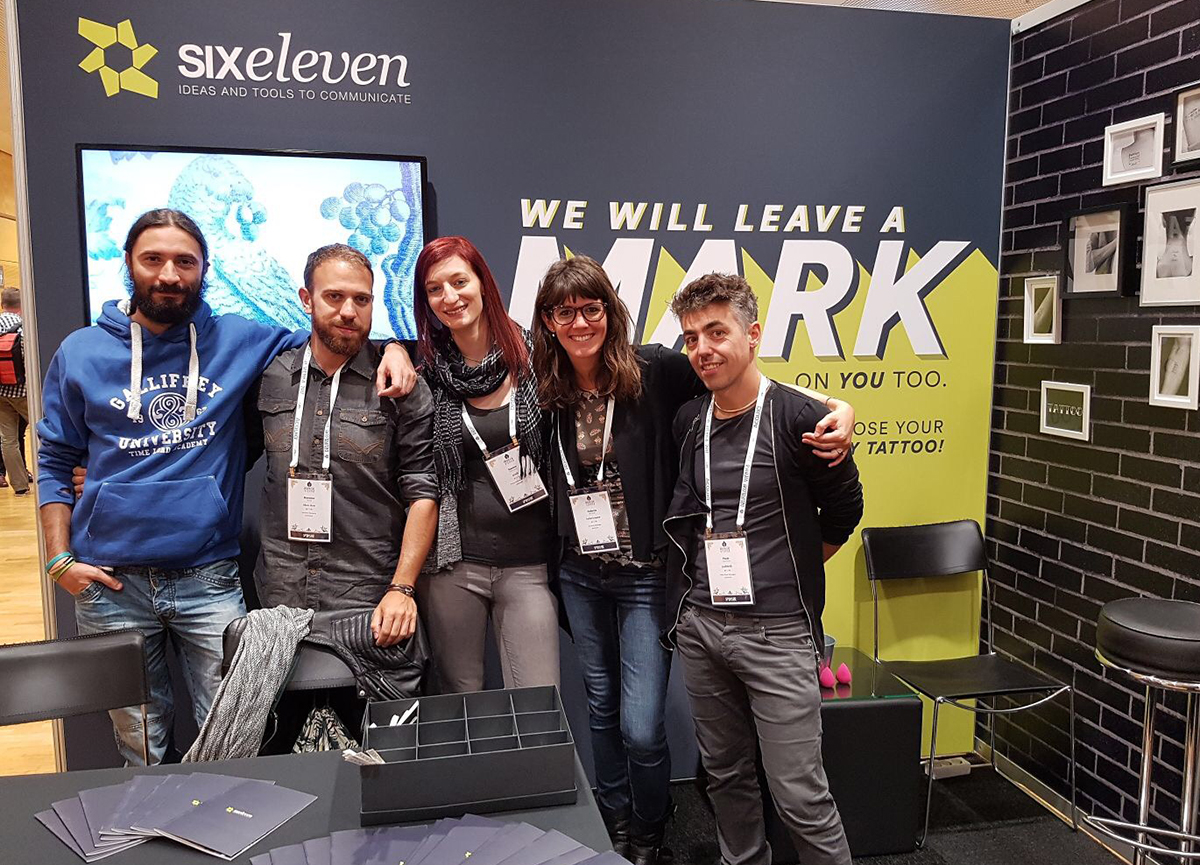 my team and I in front of our booth